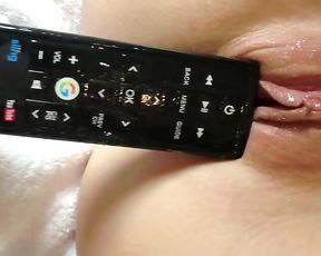 Steamy female jerking with motel TV remote