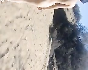 Youthfull woman ambling bare in public beach