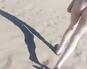 Youthfull woman ambling bare in public beach