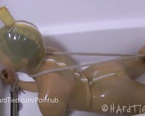 Dark-Hued-Haired Fledgling in Latex Bound in Rope Tortured Erotically in Water