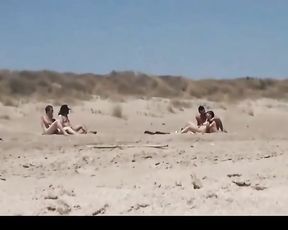 Couple split by strangers on a naked beach