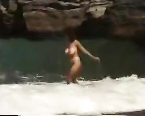 Ample globes dame nude on the solitary beach