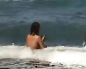 Ample globes dame nude on the solitary beach