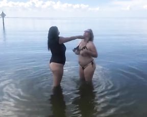 Annasteisa_Kisses and BigBootyAudrey Have Fun around Bare at Beach