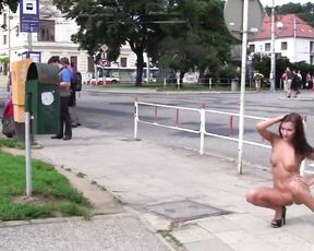 dark-haired naked in the street