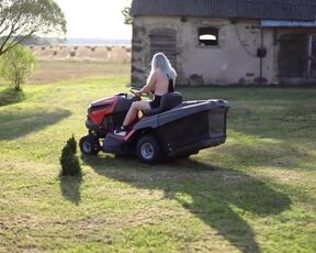 Chubby Busty Girl. Topless Woman Riding On Aa Tractor