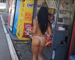 MILFA walks topless through town.