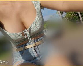 A girl on a bike shows her breasts as she rides