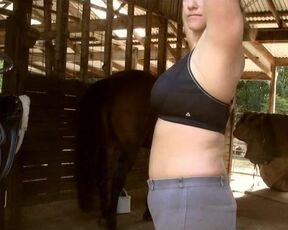 Naked lady rubbing her Boobs Riding a horse