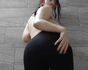 Hot brunette shows off her sagging tits in the bathroom