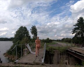 Nude woman on the bridge