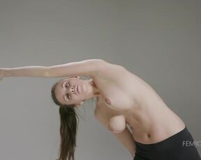 Sporty girl is doing her daily workout routine and taking off her clothes