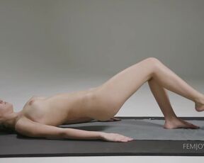 Sporty girl is doing her daily workout routine and taking off her clothes