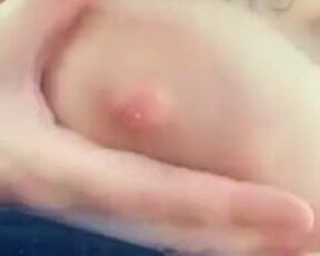 She squeezes jets of her milk out of her nipple