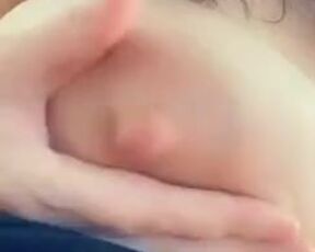 She squeezes jets of her milk out of her nipple