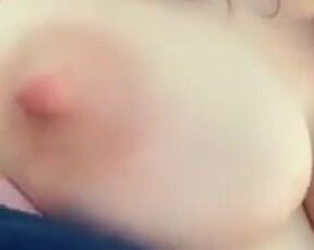She squeezes jets of her milk out of her nipple