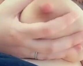 She squeezes jets of her milk out of her nipple