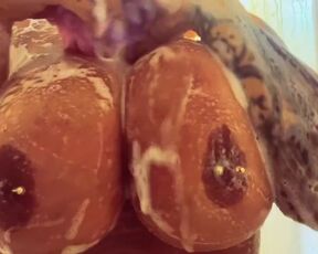Black wet boobs in white foam. Busty video in bathroom