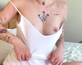 Tattooed and pierced teen girl shows small tits and pussy.
