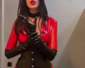 Domme flaunts in front of a mirror