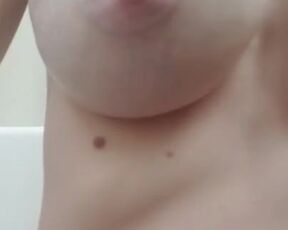 Milk drips from the pregnant lady's breasts