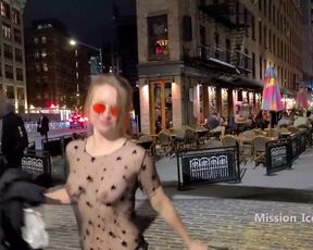 Switching into sheer sundress on a active downtown night