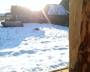 A redheaded Russian beauty naked in the snow.