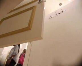 Women's locker room. Trying on swimsuits for boobs