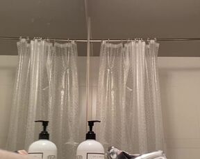 Peeping in the bathroom at a titty blonde