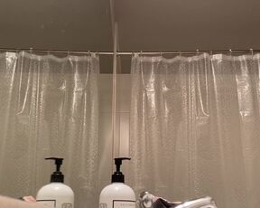 Peeping in the bathroom at a titty blonde