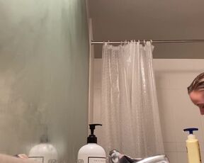 Peeping in the bathroom at a titty blonde