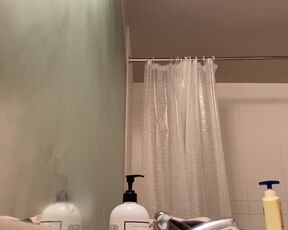 Peeping in the bathroom at a titty blonde