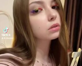 Nymphet shows her young tits on cam