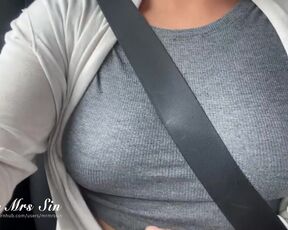 Buckled up in the car. But those boobs are coming out of my seatbelt.