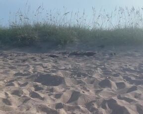 Housewife dangling out a naked beach