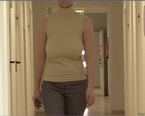 She covers her huge breasts with her hand and talks on the phone. Do you notice her nipple