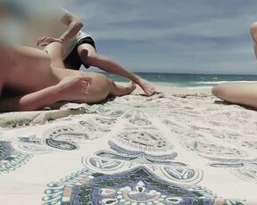 Naked massage on the beach for a couple of exhibitionists