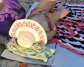 MILF with small tits touching her pussy in public beach