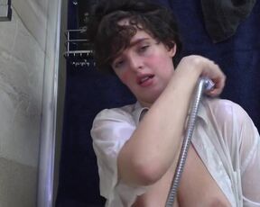 Amateur woman washes her boobs in the shower.