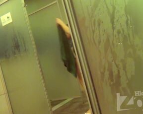 Hidden camera. Groping a woman wiping herself with a towel