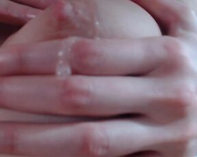 Stroking, massaging and spitting on perfect tits with super zoom (close up) scene
