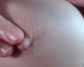 Stroking, massaging and spitting on perfect tits with super zoom (close up) scene