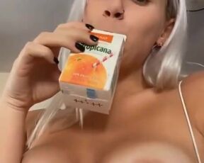 Dyed blonde drinks juice and shows her huge boobs to her subscribers