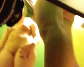 Peeping at a couple in a dressing booth