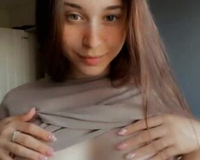 Tender beauty exposed her young breasts and rubbing her nipples. Posing nude on the phone