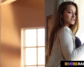 Cute brunette babe is lying on the sofa and rubbing her pussy, while a horny voyeur is watching