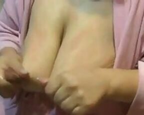 Amateur Mummy commences stroking her sagging juggs out of her thick lactating nips while in a building bathrobe