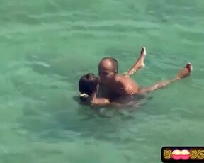 Wild duo is romping on the beach thinking that no one is observing them in act