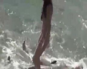 Bare gals and boys are fumbling each other on the beach, while some are even humping