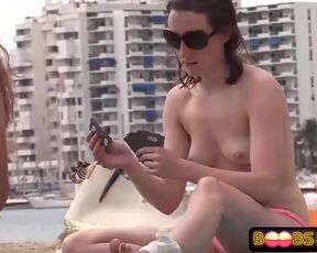 Without Bra women are frolicking cards on the beach, knowing that people are gawping at them